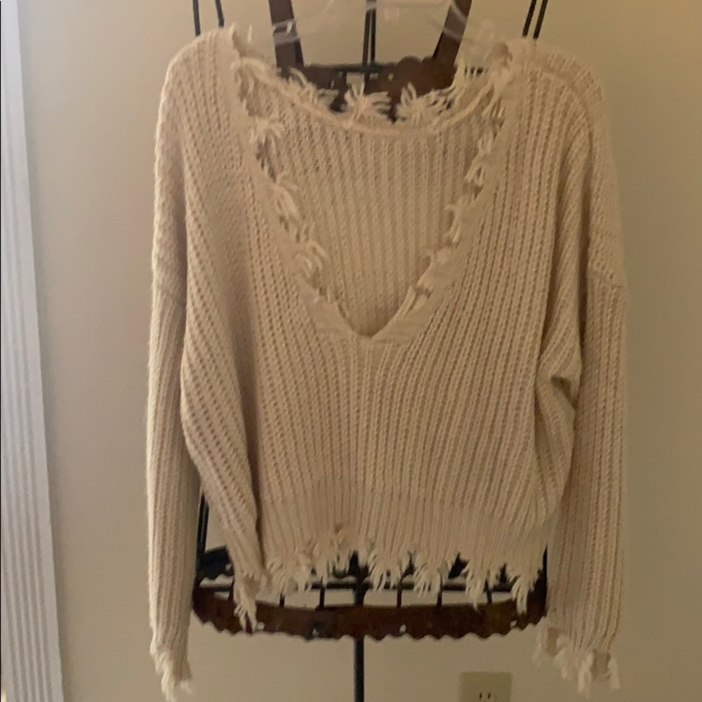 Cream sweater with fringe detail